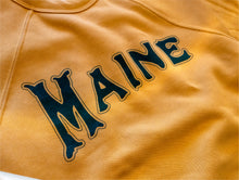 Load image into Gallery viewer, Close up of Milo in Maine mustard sweatshirt with &#39;MAINE&#39; printed on it with dark green ink